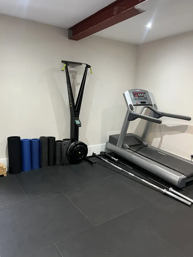 Foam rollers, the ski trainer and the treadmill in the studio